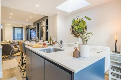 a kitchen with a sink and a living room at 3 Bed in Ulverston oc-m34782 in Ulverston