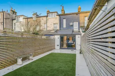 a courtyard with a bench in front of a building at 3 Bed in Ulverston oc-m34782 in Ulverston