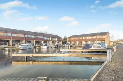 a marina with boats in the water next to buildings at 2 Bed in Carnforth oc-s34803 in Warton
