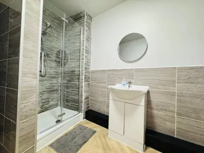 a bathroom with a sink and a shower at 12A Charming Double Room in shared home at Pembroke in Liverpool