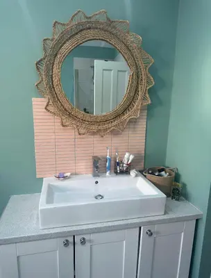 a bathroom sink with a mirror on the wall at Golf open - walking distance in Ainsdale