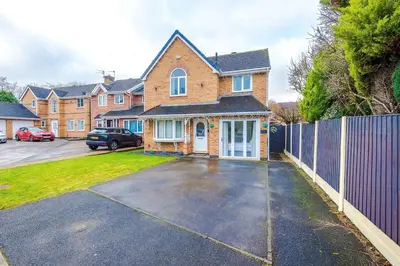 a brick house with a fence in a parking lot at Chic Preston Luxe Suite - Perfect for 2 - Free Parking by Parydise Properties in Grimsargh