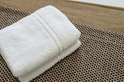 a white towel sitting on top of a table at Cemeas House - Air Host & Stay - Slps 6 - Parking in Liverpool