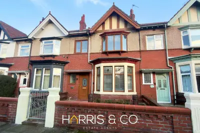 a brick house with a sign that says harris and co at Driftwood Bay in Fleetwood