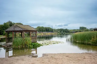 a gazebo sitting in the middle of a river at Blue Water Retreats in Carnforth