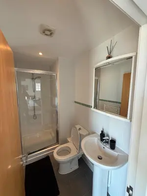 a bathroom with a toilet and a sink and a shower at Southport Coastal View Retreat in Southport
