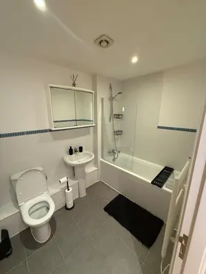 a bathroom with a toilet and a sink and a shower at Southport Coastal View Retreat in Southport