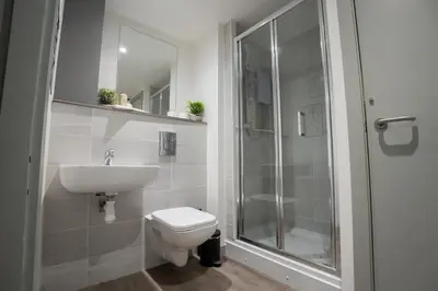 a bathroom with a toilet and a sink and a shower at Modern Apartment Liverpool City Centre in Liverpool