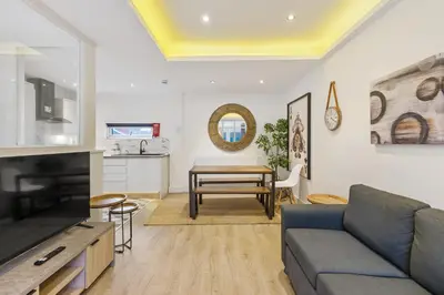 a living room with a couch and a table at The Slater Pad - Party Apartment in Liverpool City Centre in Liverpool