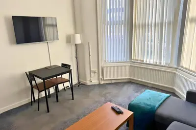 a living room with a couch and a table at 1 Bedroom apartment by Brookland Stays Serviced Accommodation & Short Lets in Blackpool in Blackpool
