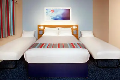 a pair of beds in a hotel room at Travelodge Liverpool Central Exchange Street in Liverpool