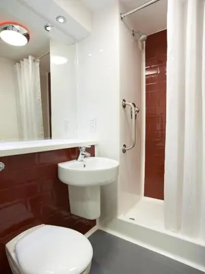 a bathroom with a toilet and a sink and a shower at Travelodge Liverpool Central Exchange Street in Liverpool