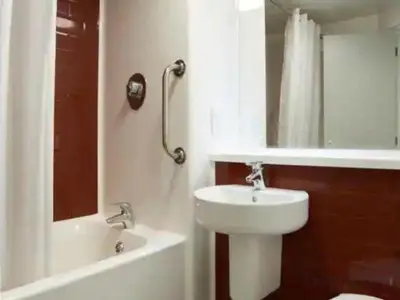 a bathroom with a sink and a toilet and a shower at Travelodge Morecambe in Morecambe