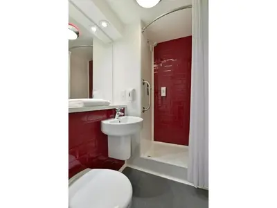 a bathroom with a toilet and a sink and a shower at Travelodge Lytham St Annes in Saint Annes on the Sea
