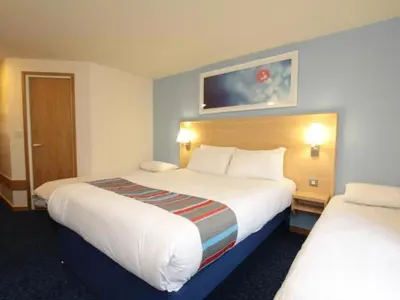 a hotel room with two beds at Travelodge Preston Central in Preston