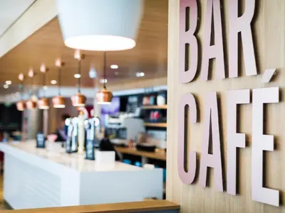 a bar sign on the wall of a restaurant at Travelodge Preston Central in Preston