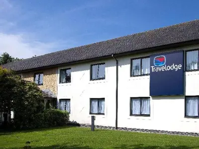 a large white building with a truckride sign on it at Travelodge Burton M6 Northbound in Holme