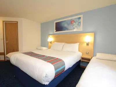 a hotel room with two beds in a room at Travelodge Barrow In Furness in Barrow in Furness