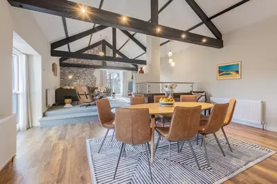 a dining room with a table and chairs at The Royal Oak Barn Cartmel - Sleeps 4 in Cartmel