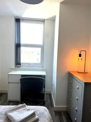 a bedroom with a desk and a window at Contractors House - 10 Seperate Beds - FREE Parking in Liverpool