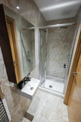 a bathroom with a shower and a sink at Luxury Studio Apartment in Liverpool City Centre in Liverpool