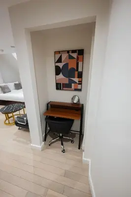 an office with a desk and a chair in a hallway at Luxury Studio Apartment in Liverpool City Centre in Liverpool