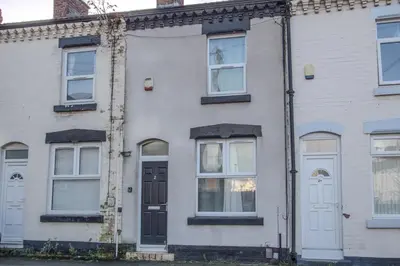 an old white house with white doors and windows at Charming & Relaxing Getaway near Liverpool City in Liverpool
