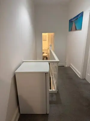a hallway with a white counter in a room at The Fabulous Gem in Wallasey in Wallasey