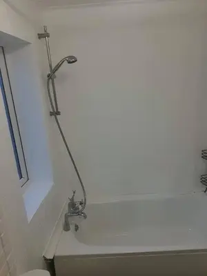 a bathroom with a shower and a bath tub with a sink at Warm & Welcoming Balfour Getaway in Wallasey