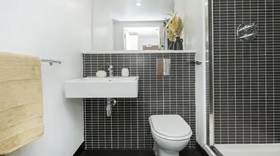a bathroom with a white toilet and a sink at For Students Only Windsor Court in Liverpool in Liverpool