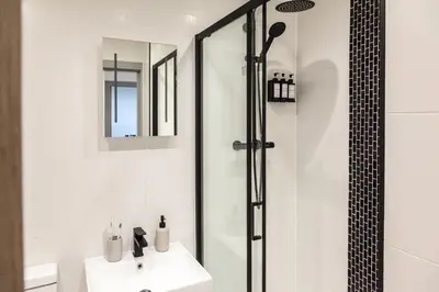 a bathroom with a shower and a sink at Dreams stay in Preston