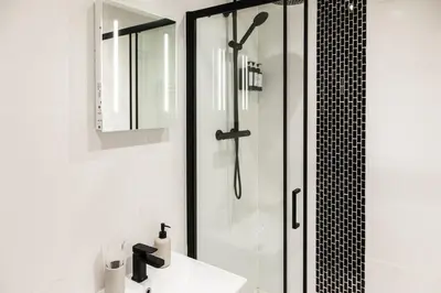 a bathroom with a shower and a sink at Dreams stay in Preston