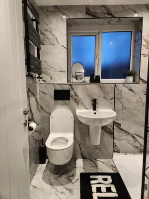 a bathroom with a white toilet and a sink at Kashkana Haven - Blackburn in Cherry Tree