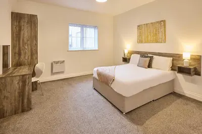 a bedroom with a large bed and a window at Host & Stay - Showtime Studio in Blackpool