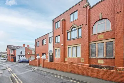 a brick building on the side of a street at Host & Stay - Promenade Suite in Blackpool