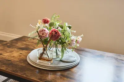 a vase of flowers sitting on a table at Host & Stay - Tower Suite in Blackpool