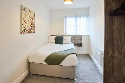 a small bedroom with a bed in a room at Host & Stay - Tower Suite in Blackpool
