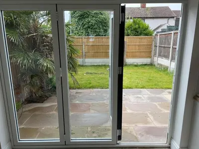 an open door to a patio with a yard at Modernised fisherman's house near Lytham centre in Brown Moss Side