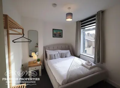 a small bedroom with a bed and a window at 30 Telford St by Prestige Properties SA in Barrow in Furness