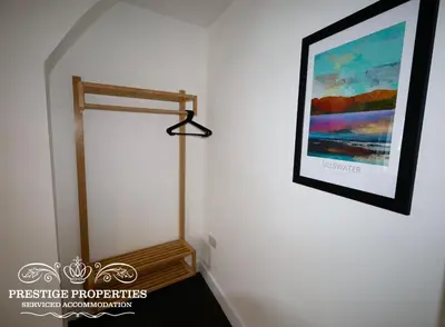 a picture hanging on a wall with a painting on the wall at 30 Telford St by Prestige Properties SA in Barrow in Furness