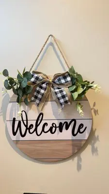a welcome sign with a bow on a wall at 3 bedroom modern newly renovated house in Preston in Preston