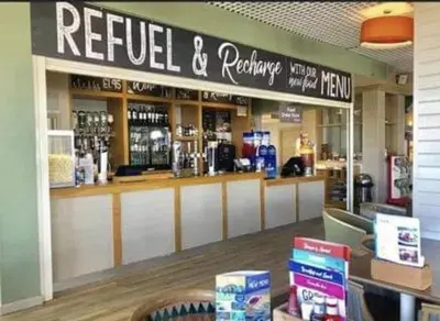 a restaurant with areel and refridgerator at Mason's Morecambe Memories in Heysham