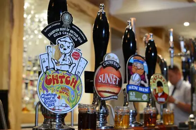 a bunch of bottles of beer on a bar at The Morecambe Hotel in Morecambe