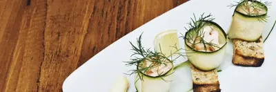 a white plate with some food on a table at The Morecambe Hotel in Morecambe
