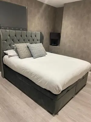 a bed with two pillows on it in a bedroom at Cozy 1 bed apartment Blackpool in Blackpool