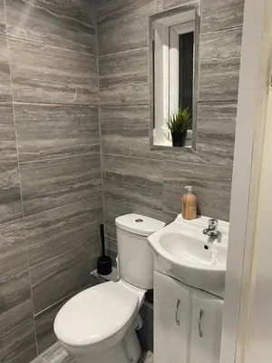 a bathroom with a toilet and a sink at Cozy 1 bed apartment Blackpool in Blackpool