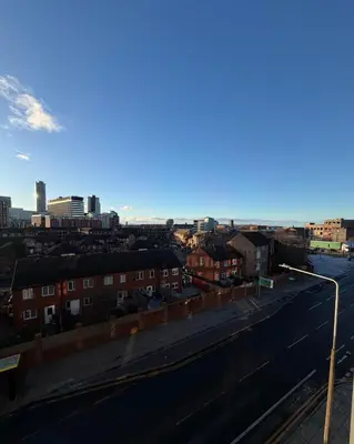 a view of a city with buildings and a street at 2-Bed City View with Balcony Liverpool by StaySavvy Accommodation in Liverpool