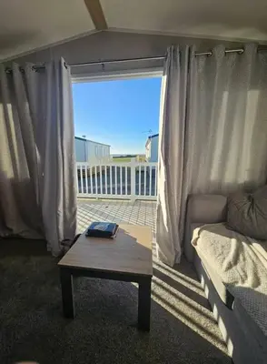 a living room with a couch and a coffee table at Crozzer's Place in Heysham
