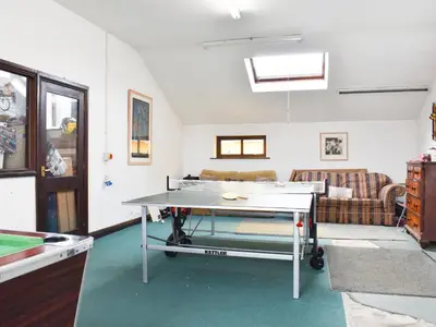 a living room with a ping pong table in it at Yan Cottage - Uk43540 in Spark Bridge