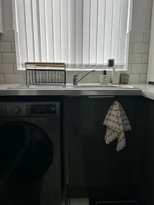 a kitchen with a sink and a dish towel at Music touch house Free Parking WIFI Close to Anfield stadium in Liverpool